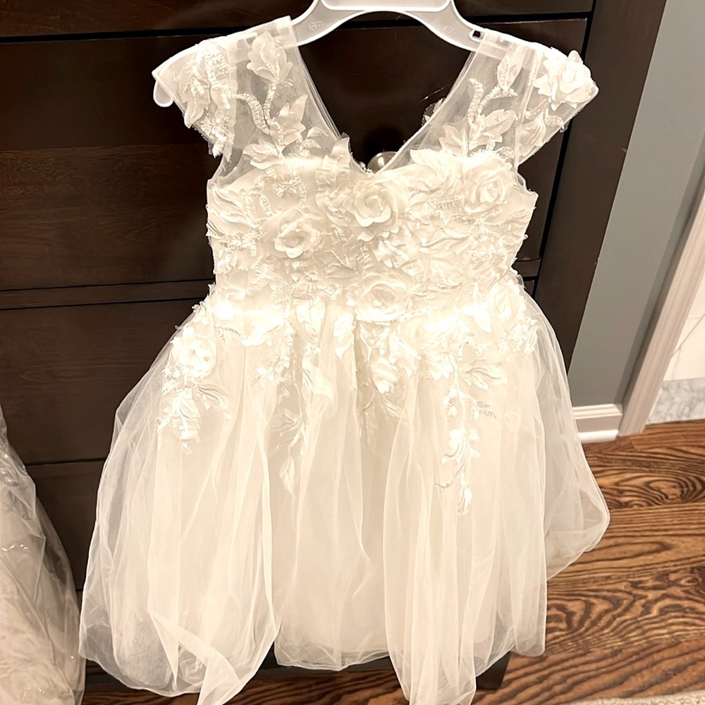 Dry cleaned, worn once, ivory flower girl dress